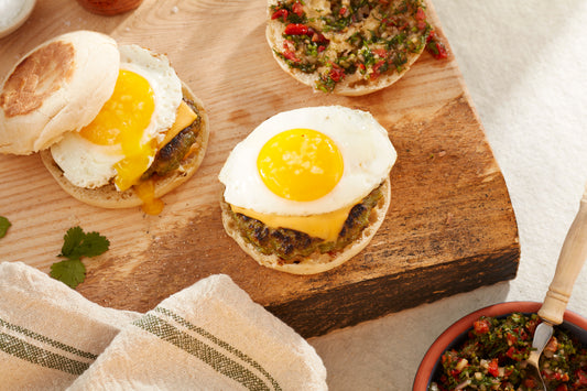 chorizo verde egg sandwich on a cutting board